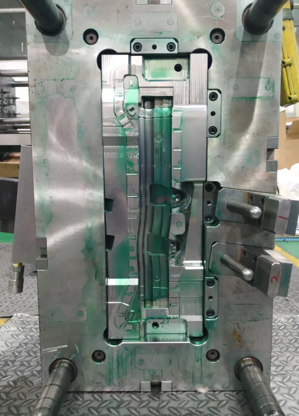 Long-form automotive cavity with multiple side-action interfaces