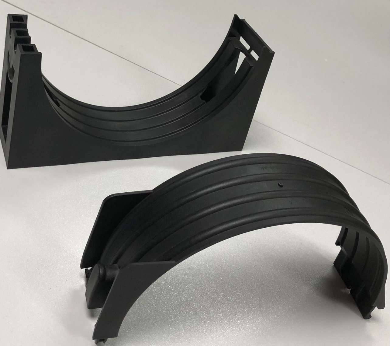 Curved housing sections — product photograph